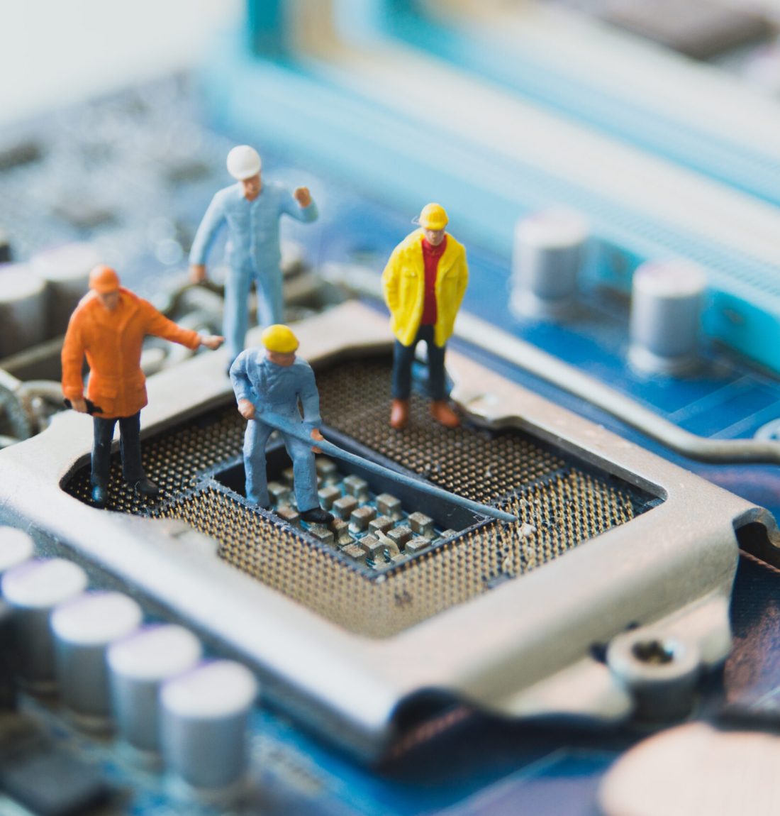 Miniature people Network Engineers At mainborad computer